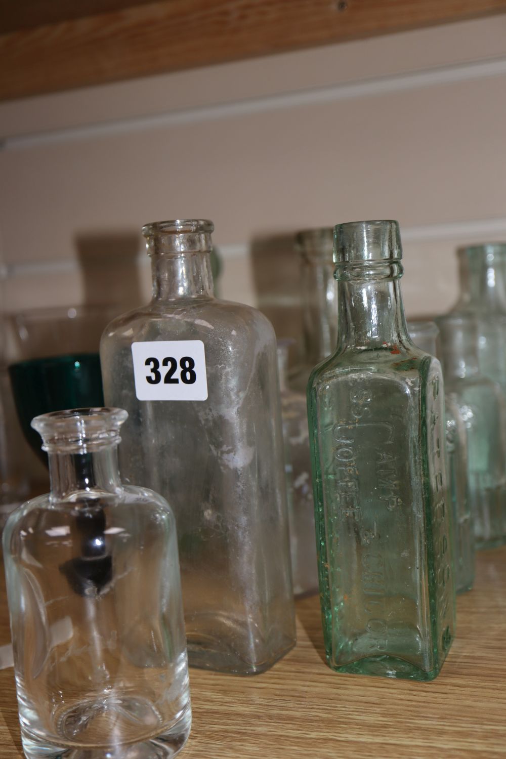 A quantity of glasses and glass bottles